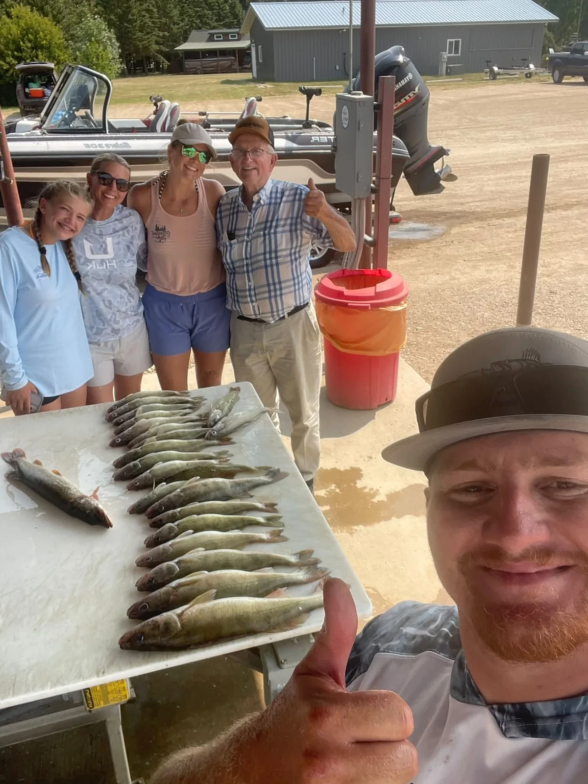 Fishing group with a successful catch at the cleaning station